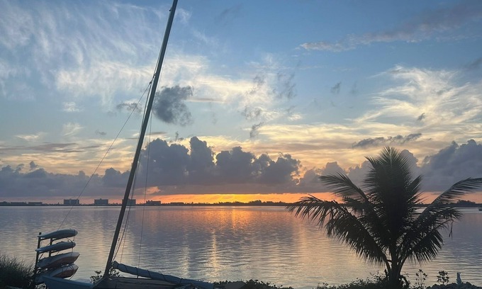 Jensen Beach House | Waterfront luxury bungalow with private beach, paddleboards, kayaks and bikes!