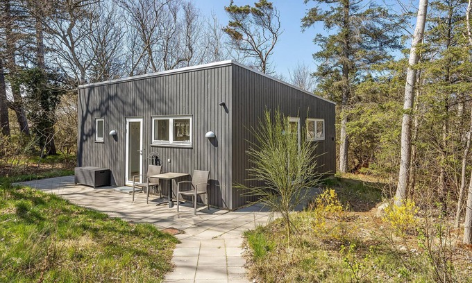 Udsholt Sand House | Wonderful, modern home on wooded lot right on the water.