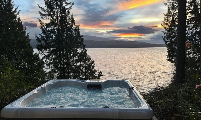 Adelma Beach Cabin | Woodsy Waterfront: Hot Tub, Sauna, Movie Theater & Fireplace!