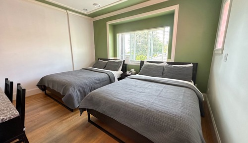 Deluxe Quadruple Room, 2 Queen Beds, Private Bathroom (Room G)