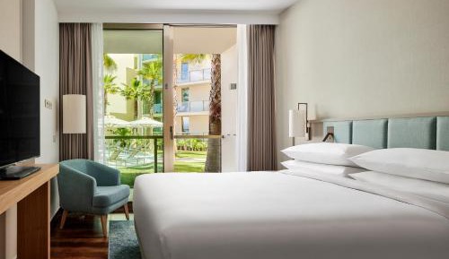 One-Bedroom King Suite with Balcony and Pool View