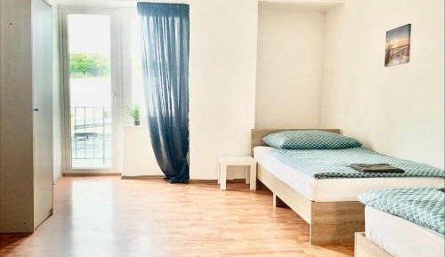 Three-Bedroom Apartment with Balcony
