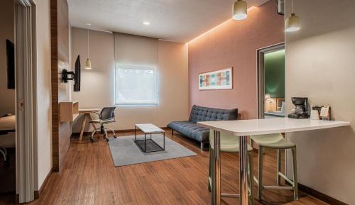 Two-Bedroom Suite with One King and Two Double Beds with Sofa Bed and Kitchenette