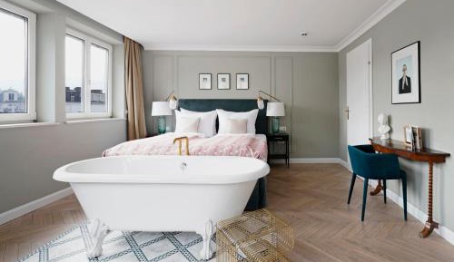 Extra Large Room with Bathtub and Separate Living Area with Sofa Bed