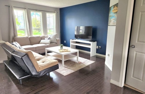 Southeast Edmonton House | House in Summerside with a huge patio and an extra tall garage