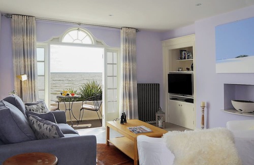 Sandgate Cottage | Relax on your balcony and enjoy the stunning, far reaching sea views overlooking Sandgate Bay.