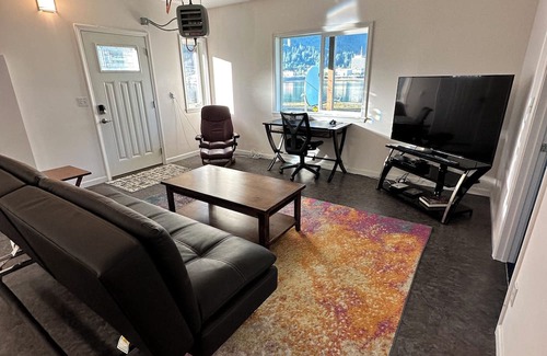 Juneau House | Spacious beachfront retreat with views of Gastineau Channel and downtown Juneau.