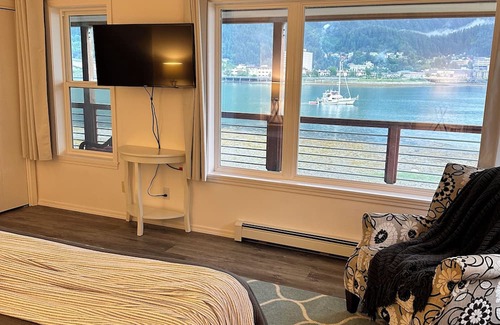 Juneau House | Spacious beachfront retreat with views of Gastineau Channel and downtown Juneau.
