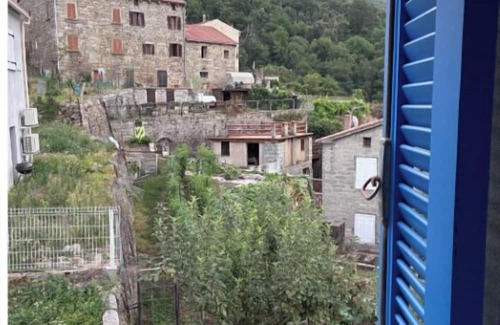 Zicavo House | Village center house with terrace.