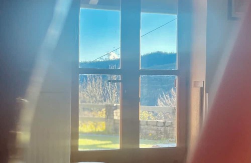 Bagnolo Piemonte House | House in the green, between peace and silence