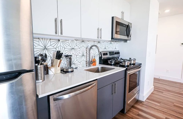 Imagine a stylish escape in Glenwood, the epitome of urban luxury