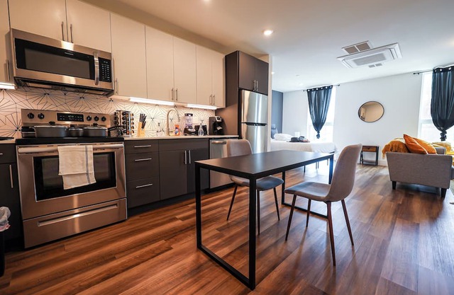 Imagine a stylish escape in Glenwood, the epitome of urban luxury