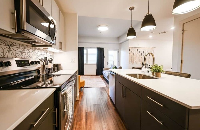 Imagine a stylish escape in Glenwood, the epitome of urban luxury