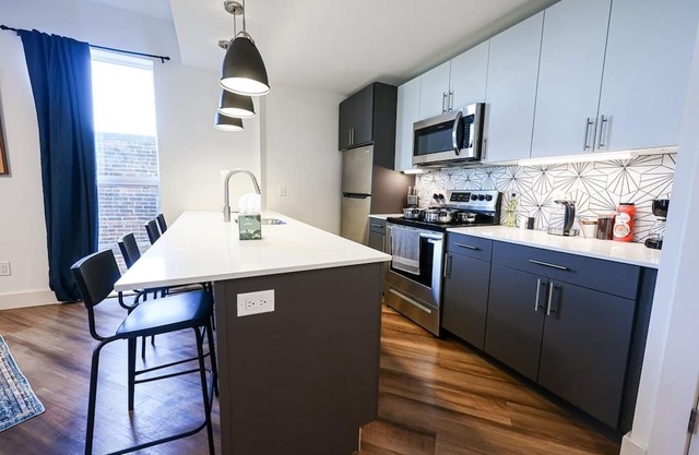 Imagine a stylish escape in Glenwood, the epitome of urban luxury