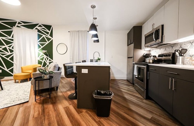 Imagine a stylish escape in Glenwood, the epitome of urban luxury