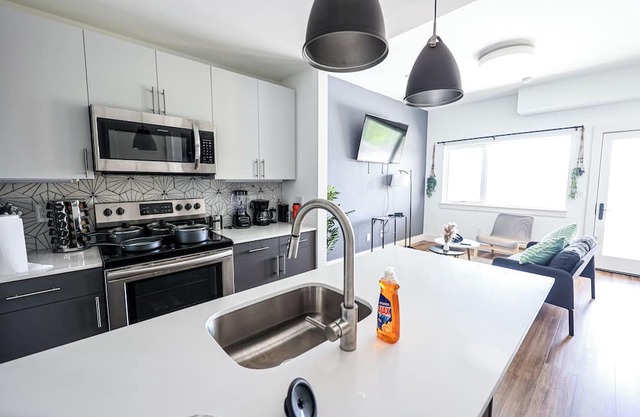 Imagine a stylish escape in Glenwood, the epitome of urban luxury