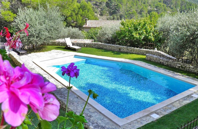 Nestled in the scenic hills of Fontaine de Vaucluse, this holiday home with a private enclosed pool