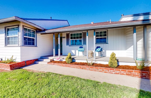 Dog-friendly home with a firepit, fireplace, foosball, enclosed backyard, grill