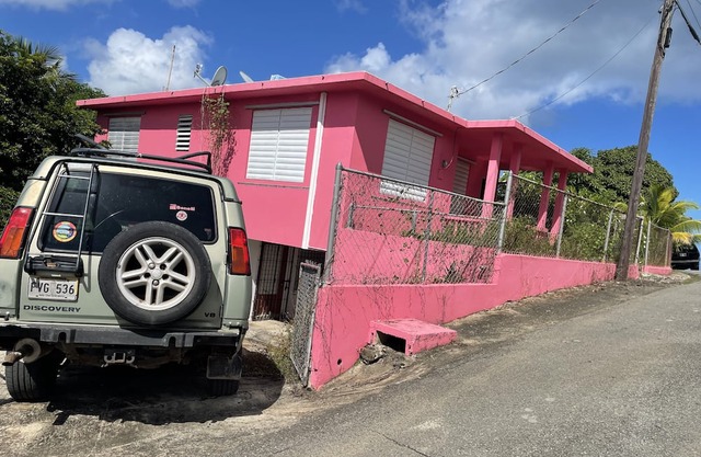 Pink House that sits on the hill and easy access to the island’s attractions.