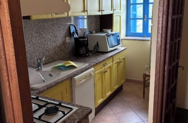 Village center house with terrace.