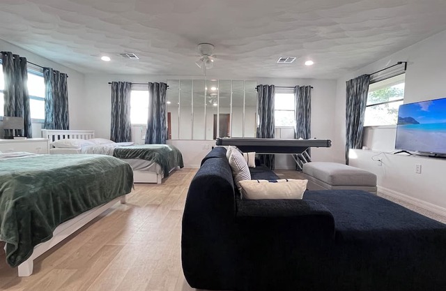 Spacious 5-bedroom pool house in Cape Canaveral with air hockey WiFi, AC