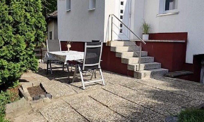 Hagen Apartment | Charming house within a house - vacation & business apartment with private terrace.