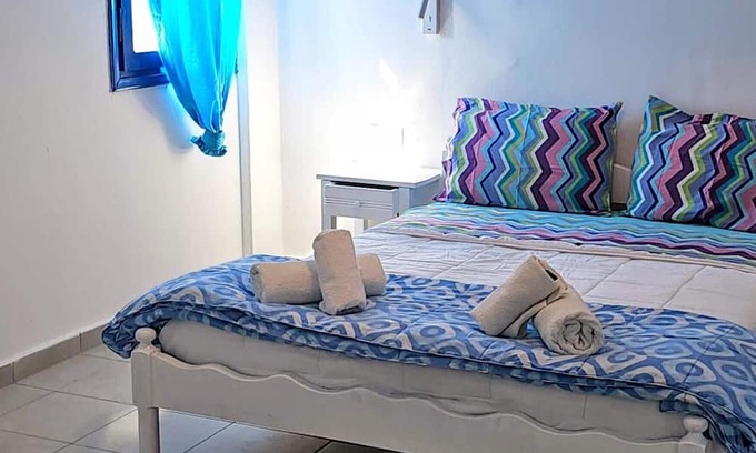 Perissa Apartment | Economy Quadruple Room 2 with Balcony and Air Conditioning